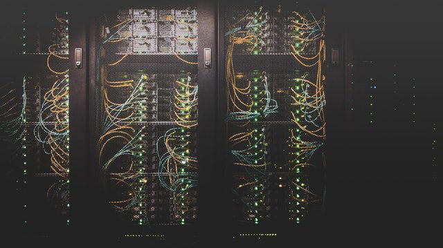 Stacks of servers and cables in a data center
