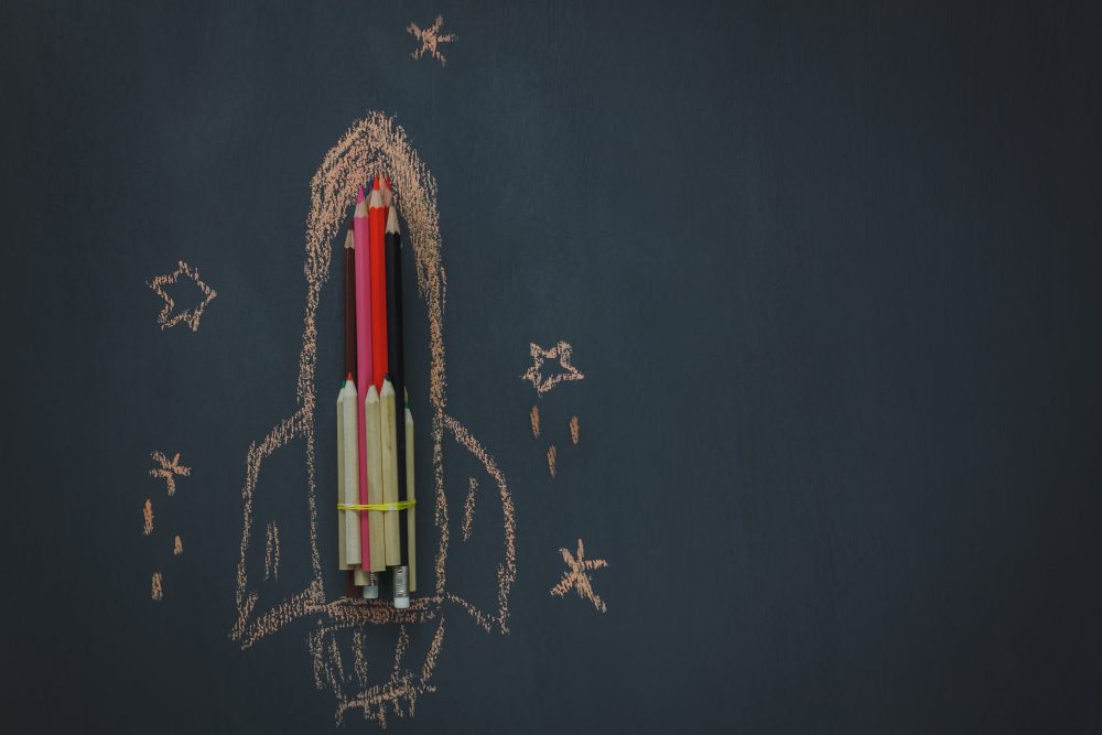 colored pencils in chalk rocket drawing