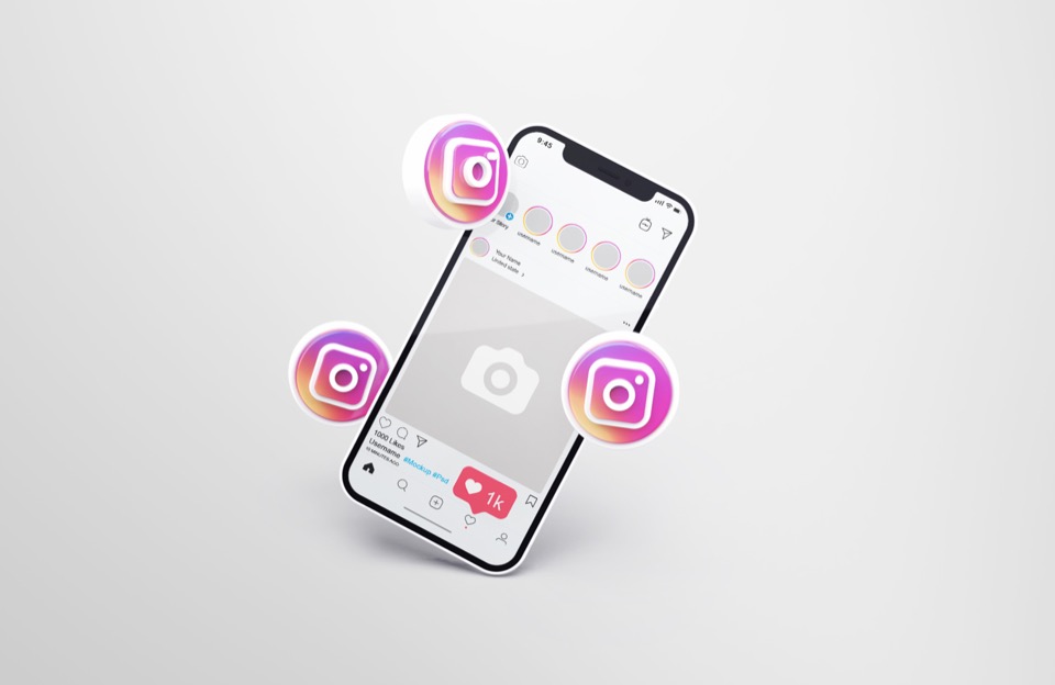 mobile phone with Instagram icons hovering over it