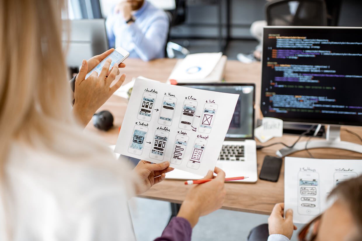 web design agencies analyzing mockups for redesign