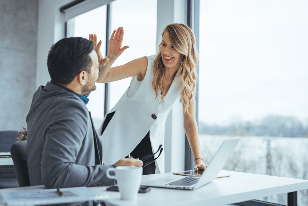 Man and woman doing a high five
