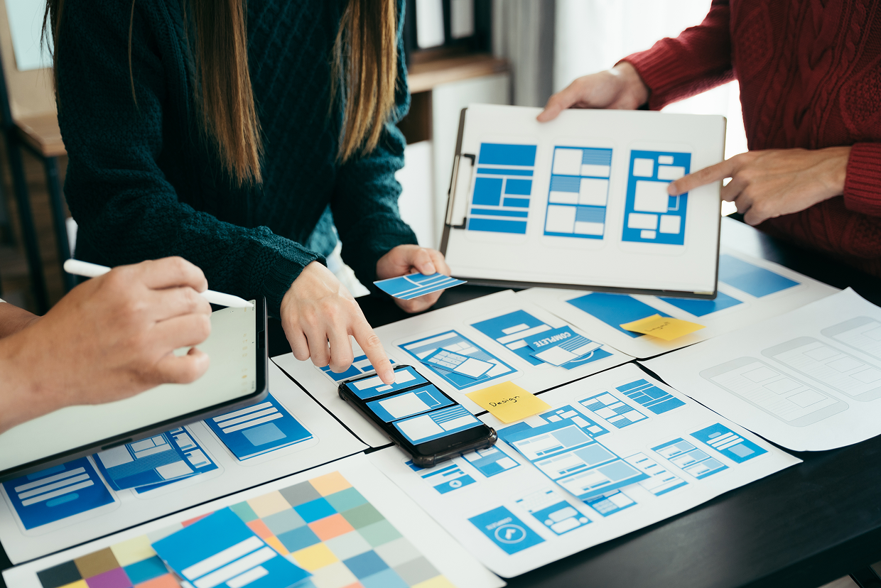 Multiple mockup designs on a desk/table