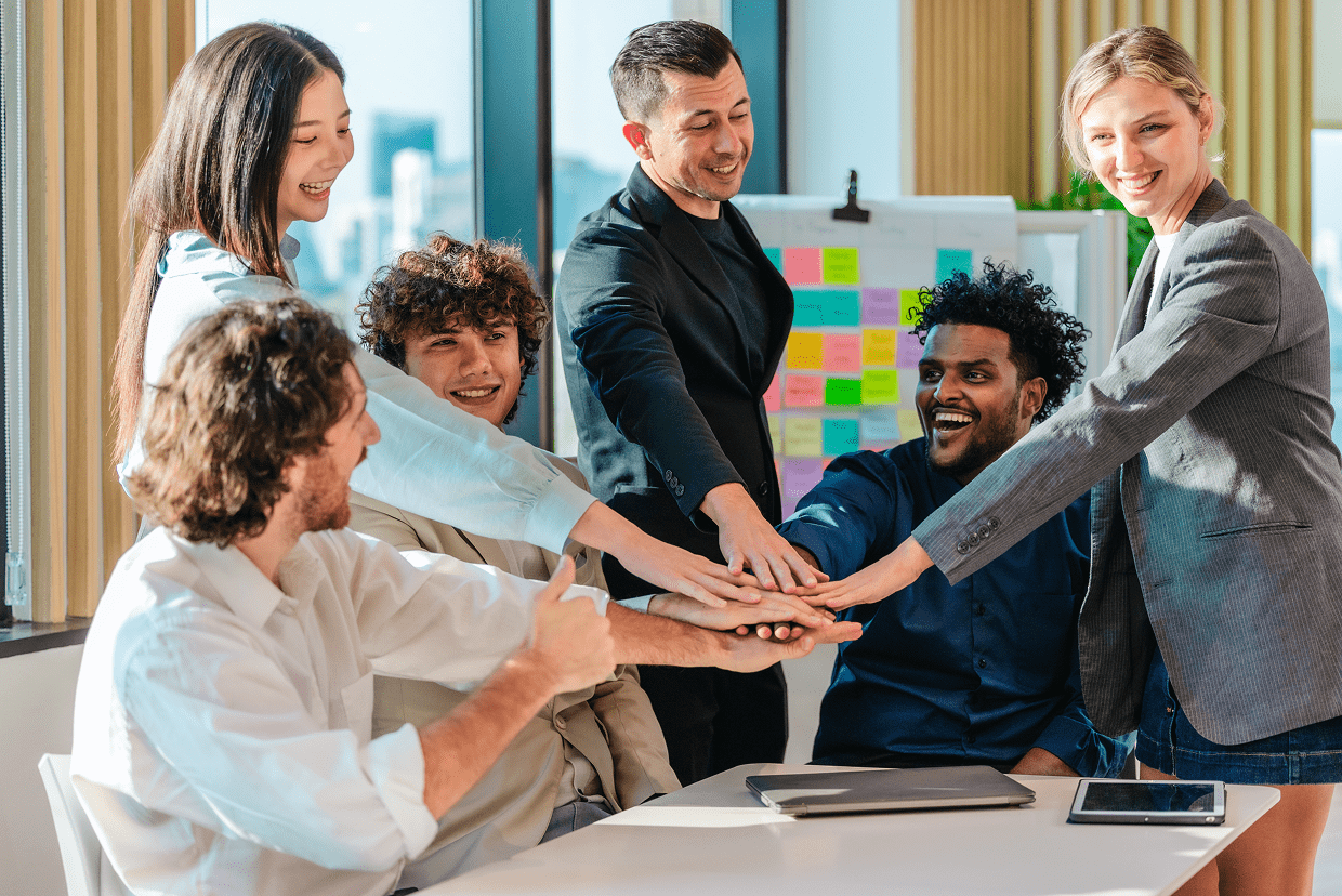 Group of people putting their hands together