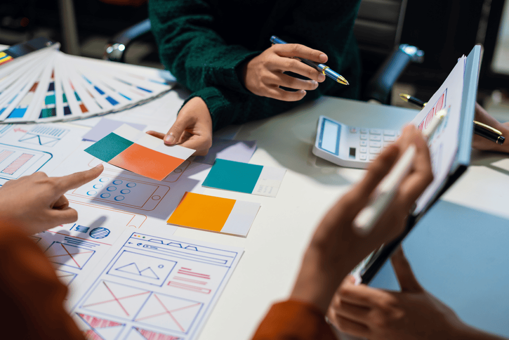 Multiple mockups and color code scheme on a table