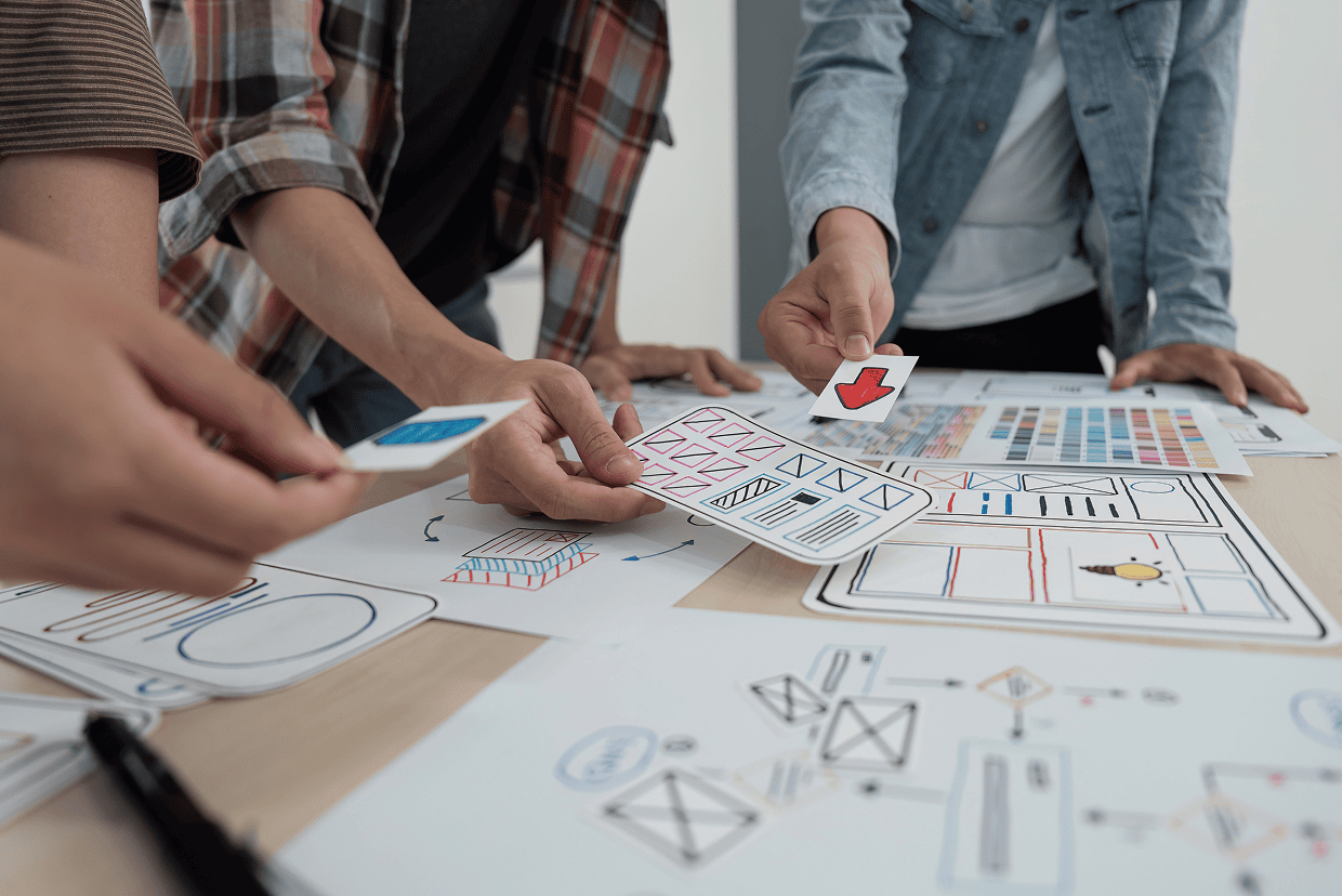 Several mockups spread out on a table